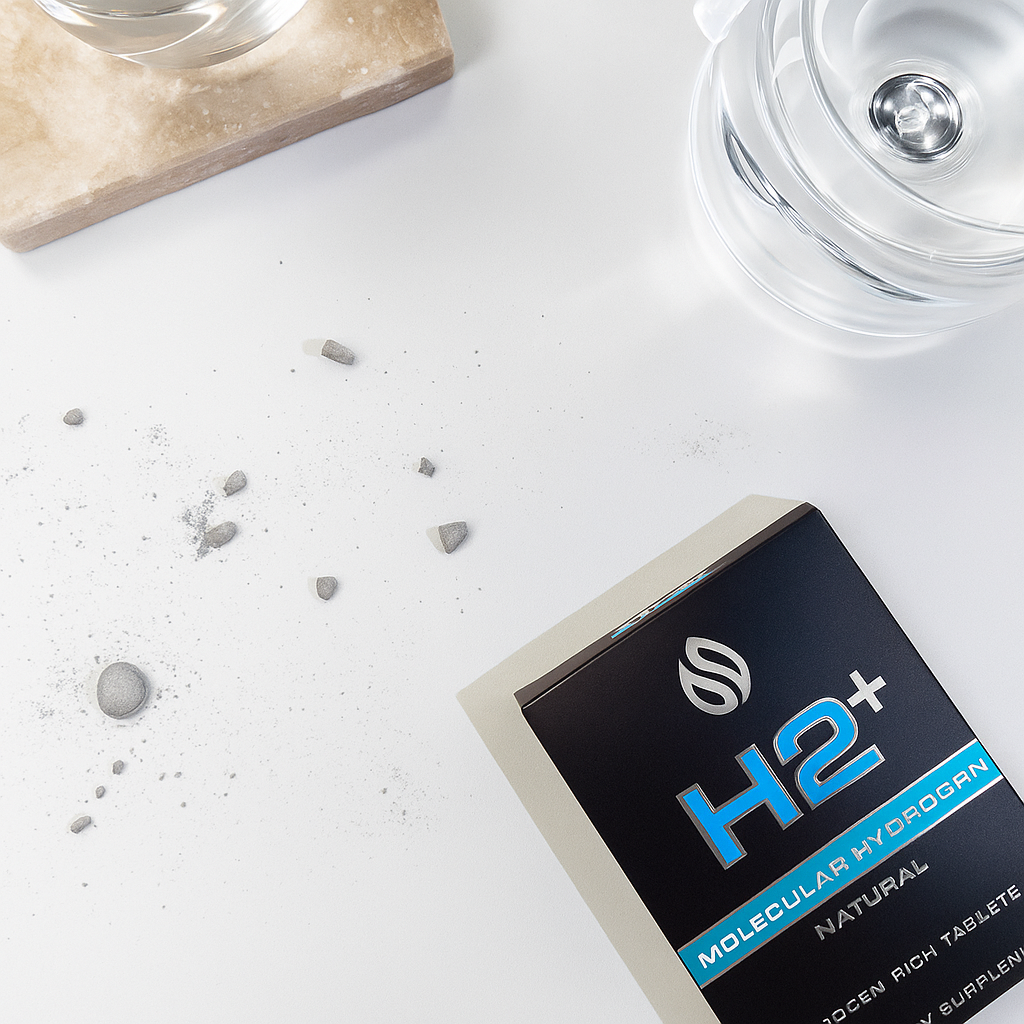 H2+ molecular hydrogen supplement packaging on a white surface with water droplets.